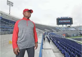  ??  ?? Memphis Express coach Mike Singletary looks out over Liberty Bowl Memorial Stadium, where the team will play its home games as part of the Alliance of American Football. JOE RONDONE/THE COMMERCIAL APPEAL