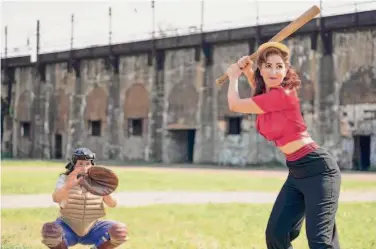  ?? Anne Marie Fox/Prime Video ?? D’Arcy Carden (right) goes to bat as a closeted 1940s baseball player in the new series “A League of Their Own,” with creator Abbi Jacobson also starring.