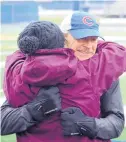  ?? ?? Athans hugs his sister, Loretta, on Saturday during his 42-mile run for his nephew and Loretta’s son, David Kreis.