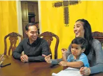  ??  ?? Castro with wife, Erica, and son, Cristián, 4, get ready Thursday for the weekend’s events that go with the announceme­nt.