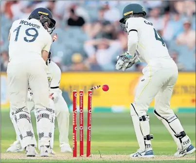  ?? ?? Chris Woakes is bowled out by Australia’s Nathan Lyon in Adelaide