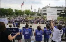  ?? STEPHEN B. THORNTON — THE ARKANSAS DEMOCRAT‑GAZETTE VIA AP ?? People gather at a rally opposing the state’s upcoming executions, on the front steps of Arkansas’ Capitol, Friday in Little Rock, Ark.