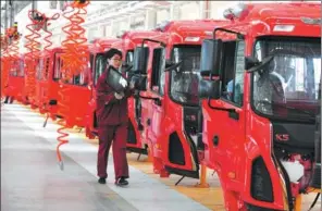  ?? LU QIJIAN / FOR CHINA DAILY ?? A worker inspects a truck assembly line of the Anhui Jianghuai Automobile Group in Fuyang, Anhui province.