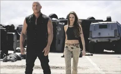  ?? PETER MOUNTAIN/UNIVERSAL PICTURES VIA AP ?? This image released by Universal Pictures shows Vin Diesel (left) and Daniela Melchior in a scene from “Fast X.”