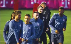  ?? (Reuters) ?? Bayern Munich coach Niko Kovac (third right) watches as players train.