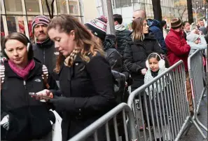  ?? — Reuters ?? ‘ Tis the season to shop: People waiting in line to enter the new FAO Schwarz store.