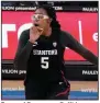  ?? (AP/Marcio Jose Sanchez) ?? Forward Francesca Belibi reacts Monday after dunking during the second half of top-ranked Stanford’s 61-49 victory over UCLA in Los Angeles.