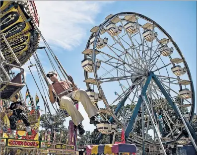  ?? | SUN-TIMES FILE ?? Carnival rides are among the many attraction­s at the annual Sandwich Fair running Sept. 5-9.