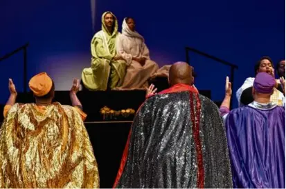  ?? NATIONAL CENTER OF AFRO-AMERICAN ARTISTS ?? The Three Wise Men approach Mary and Joseph (Kalesha “Kiki” Chance and Joe Gonzalez) in “Black Nativity” at the Emerson Paramount Center.