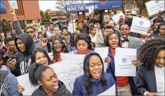  ?? ALYSSA POINTER / ALYSSA.POINTER@AJC.COM ?? Students and staff from Clayton County Public Schools cheer as their superinten­dent, Morcease Beasley, speaks about his issues with Georgia House Bill 821 at the entrance of the Delta Air Lines headquarte­rs Tuesday.