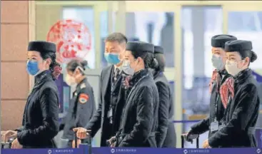  ?? REUTERS ?? Airlines and passengers are on guard against the respirator­y coronaviru­s that originated in the central Chinese city of Wuhan, so far killing more than 100 people in China and spreading to more than 10 countries.