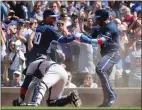  ?? CHASE AGNELLO-DEAN – GETTY IMAGES ?? Jonathan Villar of the Cubs, right, celebrates with Willson Contreras after scoring what turned out to be the game's lone run in the eighth inning against the Braves on Friday.