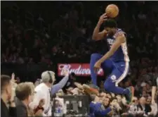  ?? FRANK FRANKLIN II — THE ASSOCIATED PRESS FILE ?? Sixers center Joel Embiid, literally taking a flying leap in New York last week, may have aggravated some knee tendinitis by doing so. He’s expected now to miss at least a week.