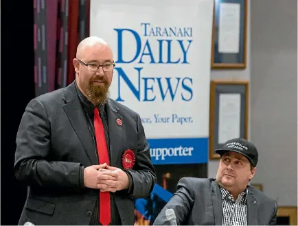  ?? SIMON O’CONNOR/STUFF ?? Labour Party candidate Corie Haddock speaks at the Taranaki Daily News election debate while NZ First’s Murray Chong looks sceptical.