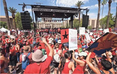  ??  ?? Teachers rally at the Arizona State Capitol on Friday for higher pay and more education funding. Legislator­s weren’t there to hear them, having adjourned for the week on Thursday.