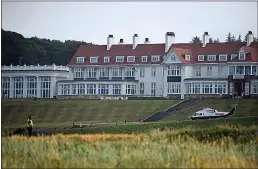  ?? ANDY BUCHANAN — AFP/GETTY IMAGES ?? Police officers stand guard at Trump Turnberry in Scotland, a luxury golf resort owned by President Donald Trump, during a visit by Trump in 2018.