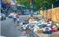 La basura sigue ocupando calles de Santo Domingo Este - PressReader