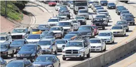  ?? FREDERIC J. BROWN/AFP/GETTY IMAGES ?? Congested traffic costs the average Los Angeles driver 104 hours sitting in gridlock during the busiest commuting times in 2016.