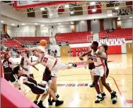  ?? Mark Humphrey/Enterprise-Leader ?? Farmington junior Layne Taylor absorbs a hard foul from Huntsville’s Amos Mayes during the Cardinals’ 80-61 victory on Saturday, Feb. 4, 2023, at Cardinal Arena. Taylor knocked down 18-of-20 free throws during the physical contest and scored a game-high 38 points.