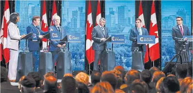  ?? JEFF MCINTOSH THE CANADIAN PRESS ?? Leslyn Lewis, left, Roman Baber, Jean Charest, Scott Aitchison, Patrick Brown and Pierre Poilievre participat­e in the Conservati­ves’ English leadership debate in Edmonton on Wednesday.