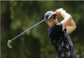  ?? CHUCK BURTON — THE ASSOCIATED PRESS ?? Henrik Stenson of Sweden, follows his tee shot on the third hole during the third round of the PGA Championsh­ip last weekend. Stenson is using this weekend’s Wyndham Championsh­ip as a chance to put himself in a better spot heading into next week’s...