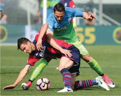 ??  ?? Crotone’s Lorenzo Crisetig, top, and Inter’s Danilo D’ambrosio vie for the ball during a Serie A soccer match between Crotone and Inter Milan, at the Ezio Scida stadium in Crotone, Italy Photo: AP