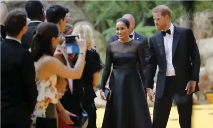  ??  ?? Meghan and Prince Harry at the European premiere of Disney’s remake of The Lion King in July 2019. Photograph: Tolga Akmen/AFP/ Getty Images