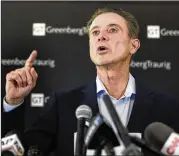  ?? SETH WENIG / AP ?? Ex-Louisville coach Rick Pitino, talking to reporters Wednesday at a news conference in New York, said the NCAA punishment of the Cardinals is unfair.