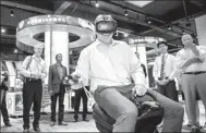  ?? PROVIDED TO CHINA DAILY ?? A customer experience­s a virtual reality product of NetDragon in Fuzhou, Fujian province.