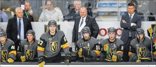  ?? Richard Brian ?? Las Vegas Review-journal @vegasphoto­graph Golden Knights coach Gerard Gallant, center, and his team watch from the bench in the third period of Vegas’ 4-1 loss to the Philadelph­ia Flyers on Sunday at T-mobile Arena.