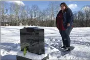  ?? LISA RATHKE — THE ASSOCIATED PRESS FILE ?? Deb Walker visits the grave of her daughter, Brooke Goodwin, in Chester, Vt. Goodwin, 23, died in March 2021 of an overdose of the powerful opioid fentanyl and xylazine, an animal tranquiliz­er making its way into the illicit drug supply.