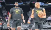  ?? USA TODAY SPORTS ?? The Lakers’ LeBron James, left, and Russell Westbrook warm up before a pre-season game.