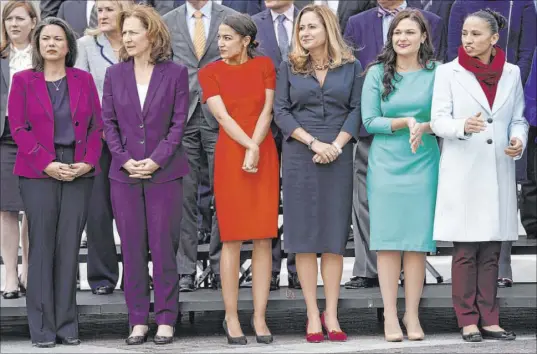  ?? Pablo Martinez Monsivais The Associated Press file ?? Rep. Abby Finkenauer, D-Iowa, second from right, poses with other freshman members of Congress for a group photo Nov. 14 on Capitol Hill. She said her constituen­ts want “a Washington that is working together to move things forward.”