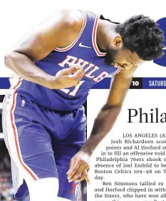  ??  ?? Philadelph­ia 76ers’ Joel Embiid looks at his injured finger during the first half against the Oklahoma City Thunder Monday in Philadelph­ia. (AP)