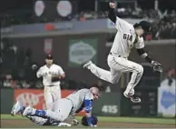  ?? Wally Skalij Los Angeles Times ?? GIANTS first baseman Wilmer Flores jumps after the Dodgers’ Matt Beaty grounded out in the ninth inning.