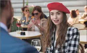  ?? Associated Press ?? Lily Collins in a scene from the series “Emily in Paris,” streaming on Netflix.