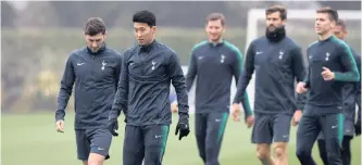  ??  ?? SON HEUNG-MIN and Ben Davies during training with the rest of their teammates yesterday. | TONY O’BRIEN Reuters