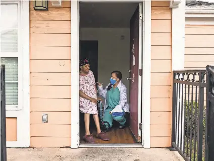  ?? PHOTOS BY EDMUND FOUNTAIN/ USA TODAY ?? Nurse Sophia Thomas talks with Brenda DeBouse about vaccines in New Orleans.