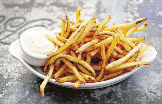  ?? Karen Warren photos / Houston Chronicle ?? French fries with aioli at a'Bouzy in River Oaks