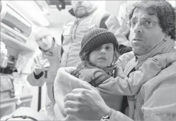  ?? Claudio Lattanzio European Pressphoto Agency ?? A CHILD was rescued from the debris of a spa hotel in central Italy, two days after an avalanche flattened the building. About 30 guests and staff were trapped under 15 feet of snow, tree trunks and boulders.