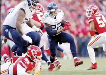  ?? AP PHOTO/JEFF ROBERSON ?? Tennessee Titans’ Derrick Henry (22) runs during the first half of the NFL AFC Championsh­ip football game against the Kansas City Chiefs on Sunday, in Kansas City, Mo.