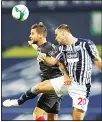  ??  ?? Brentford’s Emiliano Marcondes Camargo Hansen (left), and West Bromwich Albion’s Branislav Ivanovic head for the ball during their English League Cup soccer match between West Bromwich Albion and FC Brentford in West Bromwich, England on Sept 22. (AP)