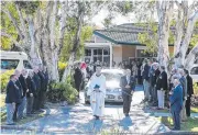  ??  ?? The hearse leaves St Paul’s Anglican Church.