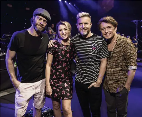  ?? Picture: MICHAEL WILSON, THE WEST AUSTRALIAN ?? LONGSTANDI­NG FRIENDSHIP: Take That members Howard Donald, Gary Barlow and Mark Owen pictured with Dannii Minogue, who is opening for the band on their tour of Australia.