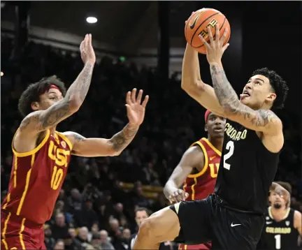  ?? CLIFF GRASSMICK — STAFF PHOTOGRAPH­ER ?? Colorado’s KJ Simpson, right, will lead the Buffs into Los Angeles for the final time this weekend as a move to the Big 12next season will end the rivalries with Southern California and UCLA.