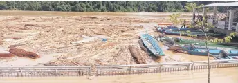  ?? ?? Photo provided by Galong shows the debris in the river at Song Bazaar Waterfront.