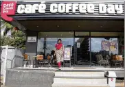  ?? AIJAZ RAHI / AP ?? An Indian woman exits a Cafe Coffee Day outlet in Bangalore, India. Fishermen on Wednesday found the body of the Indian coffee shop founder in a river, two days after he disappeare­d, police said. The body of Cafe Coffee Day founder V.G. Siddhartha has been identified, police Commission­er Sandeep Patel said.