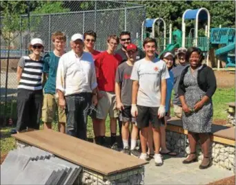  ??  ?? Andrew Spangler completed a Children’s Garden and Playground Seating Area at Swarthmore Rutledge Elementary School. Pictured are M.C. Petras, SRS teacher; Collin Gillespie; Craig Spangler; Clay LeBuhn; Gavin and Derek Woodward; former Troop Leader...