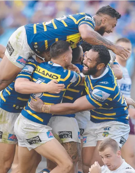  ?? Picture: GETTY IMAGES ?? Eels players celebrate yet another try in their remarkable form reversal against Manly.
