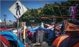  ?? August. Photograph: Joebeth Terríquez/EPA ?? Migrants camp at El Chaparral shelter in the Mexican border city city of Tijuana in